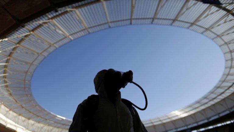 A Brazilian army personnel wearing a gas mask takes part in a simulated chemical and radiological attack exercise at the Mane Garrincha National Stadium in Brasilia on 9 June, 2014.