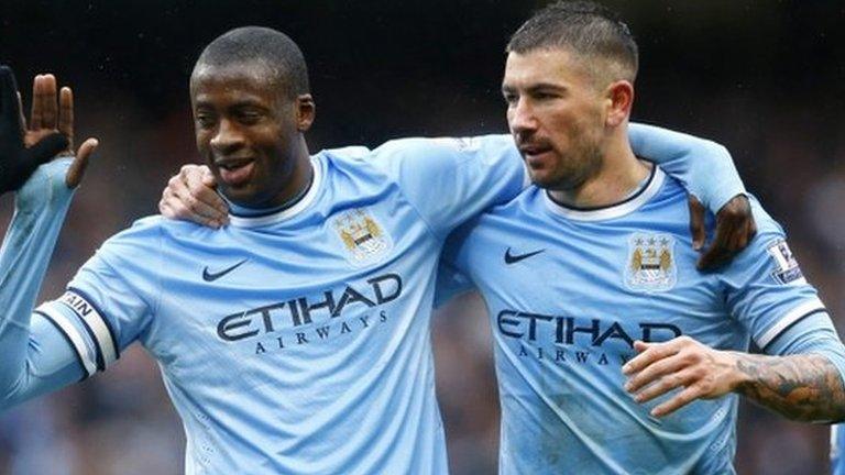 Manchester City defender Aleksandar Kolarov (right)