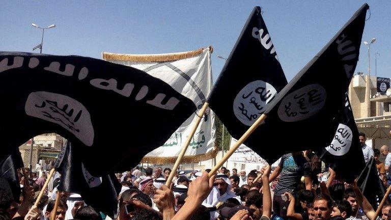 Pro-ISIS rally in front of the provincial government headquarters in Mosul, Iraq, Monday June 16 2014