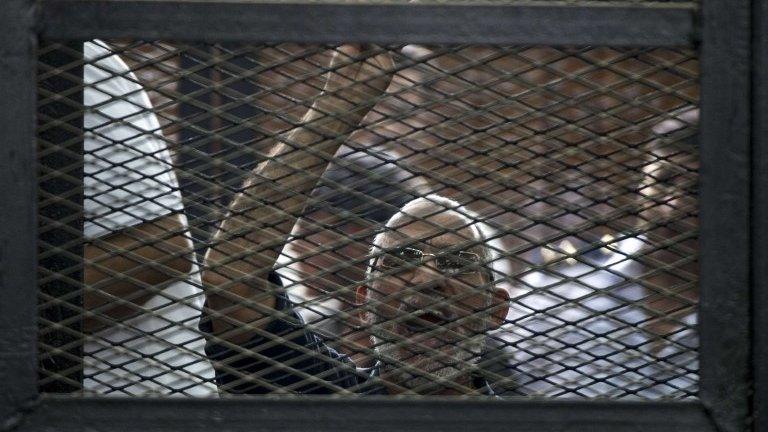 File photo: Egyptian Muslim Brotherhood leader Mohamed Badie gesturing as he shouts from inside the defendants cage during his trial in the capital Cairo, 7 June 2014