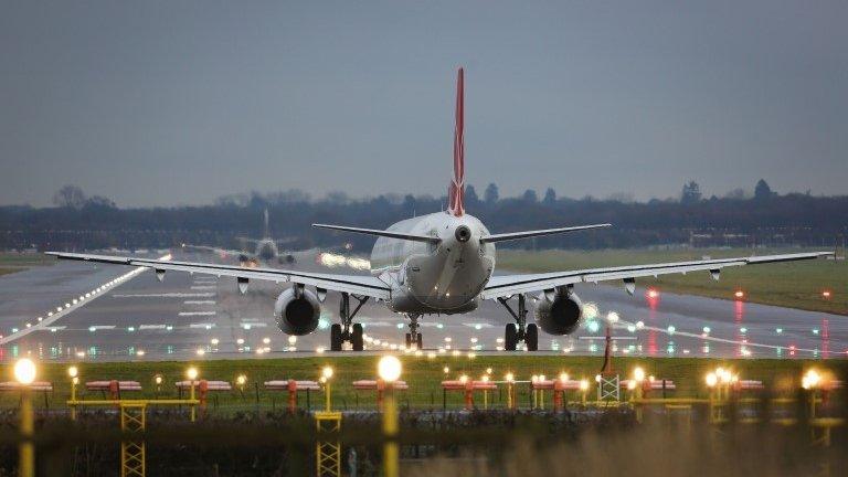 A plane on runway at Gatwick Airport