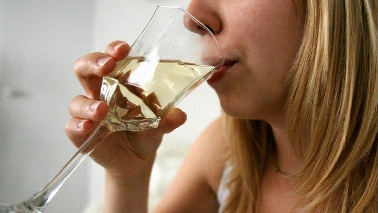 Woman drinking glass of wine