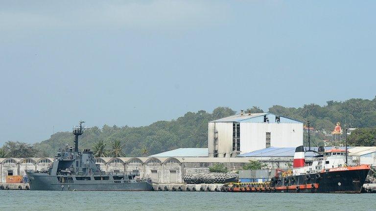 Sri Lankan naval vessel the Samudra (L) is anchored after transferring 41 would-be asylum seekers whose boat was turned away by Australia at the southern port of Galle on 7 July 2014