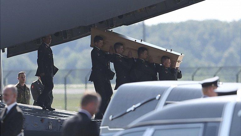 Coffin carried from plane at Eindhoven. 23 July 2014