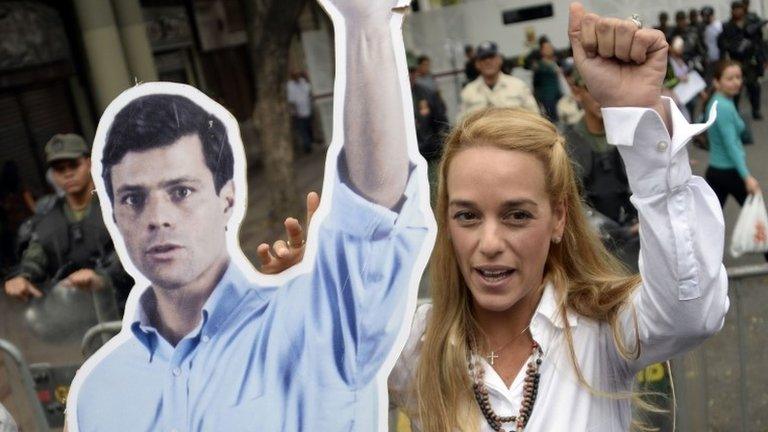 Lilian Tintori holds a poster of her husband, Leopoldo Lopez