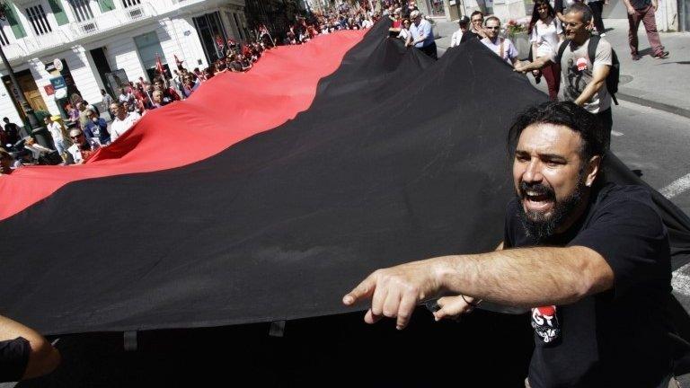 Demonstrators of the General Confederation of Work (CGT) carry a giant flag during May Day celebrations in Valencia May 1, 2014