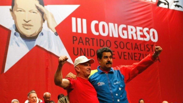 President Nicolas Maduro (right) welcomes former Venezuelan Army intelligence head Hugo Carvaja in Caracas on 27 July 2014