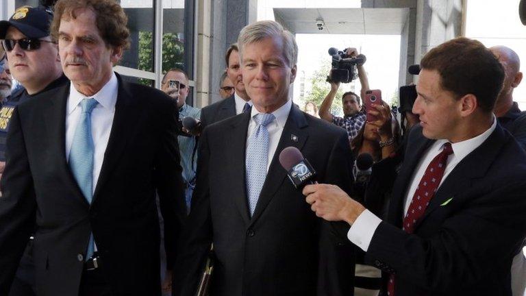 Former Virginia Governor Robert F. McDonnell, centre, with his attorney Henry W Asbill, left, arrive at the federal courthouse in Richmond, Virginia, 28 July 2014