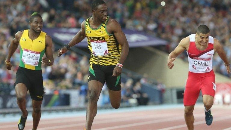 Jamaica's Kemar Bailey-Cole (centre) beats Adam Gemili (right) to gold in the men's 100m