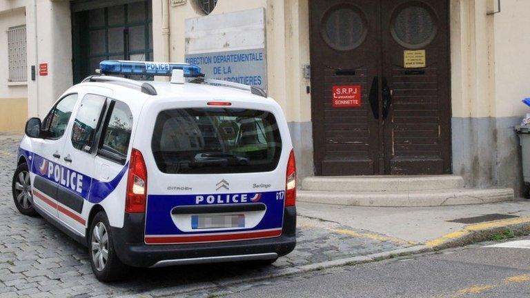 A police car outside a police station in Perpignan, southern France, 2 August