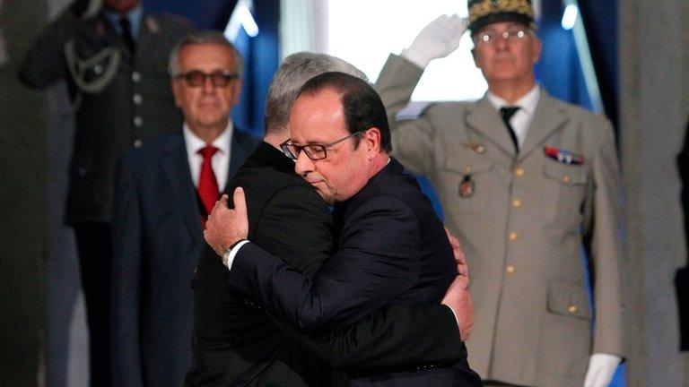 French President Francois Hollande and his German counterpart Joachim Gauck embrace during a commemoration ceremony at the WWI Hartmannswillerkopf National Monument, or Vieil Armand, in Wattwiller, north-eastern France