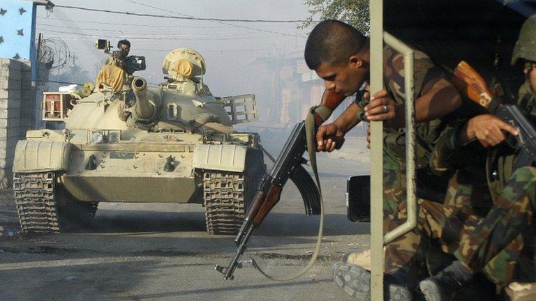 Kurdish Peshmerga forces battle IS militants in Jalawla, Diyala province. 12 July 2014