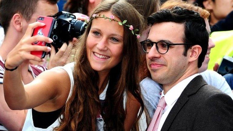 A fan takes a picture with Inbetweeners actor Simon Bird