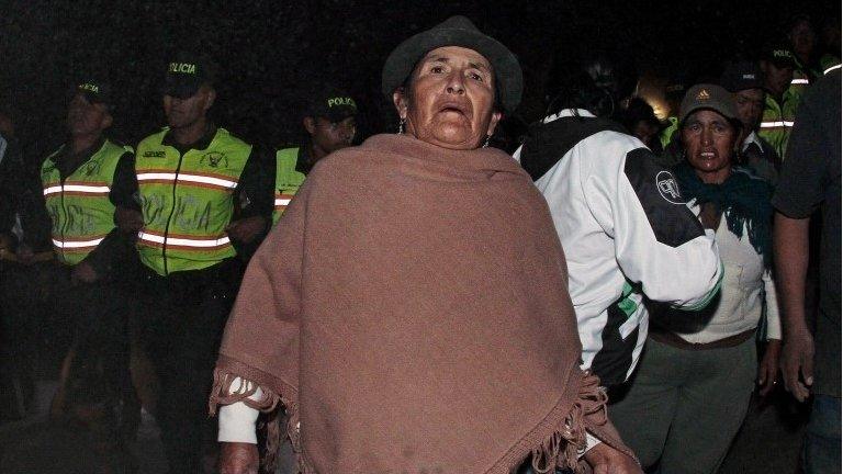 Residents of Catequilla near Quito react after a 5.1-magnitude earthquake rattled the Ecuadorean capital on 12 August, 2014