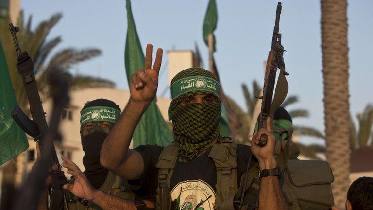 Palestinian militants from the Ezzedine al-Qassam Brigades, Hamas's armed wing, take part in a rally in Gaza City