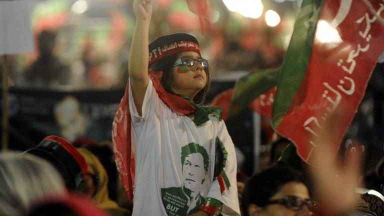 Supporters of Imran Khan, a cricketer turned politician, listen to his speech during an anti-government protest in Islamabad, Pakistan, on 28 August 2014