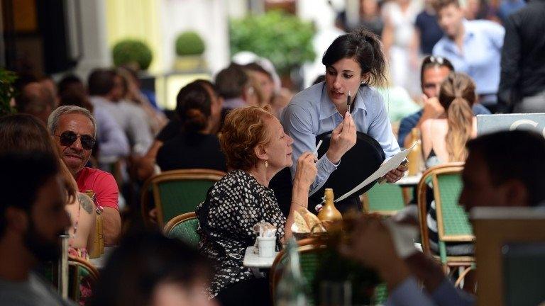 Waitress serving customer