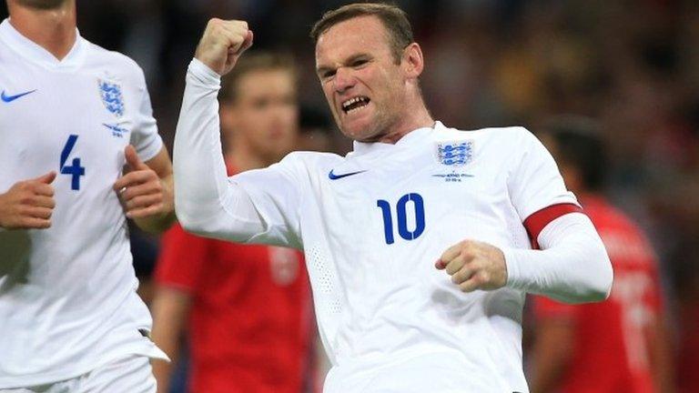 Wayne Rooney celebrates scoring for England