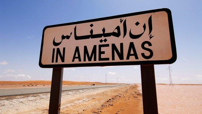 A road sign which says: "In Amenas"