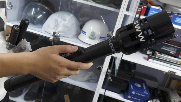 A photo made available on 23 September 2014 shows a torch that also functions as an electric shock device, displayed in a security equipment shop in Beijing on 19 September 2014