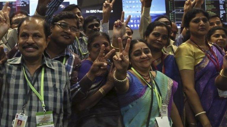 Isro staff celebrate the successful mission (24 Sept 2014)