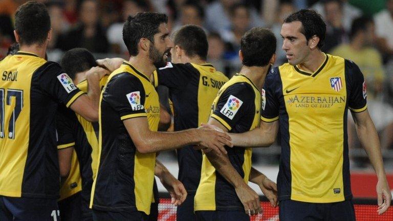 Atletico celebrate Miranda goal