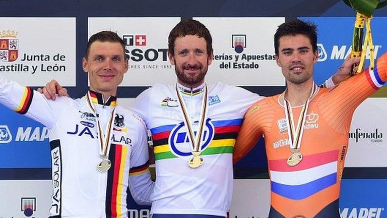 Bradley Wiggins (centre) receives his gold at the medal ceremony