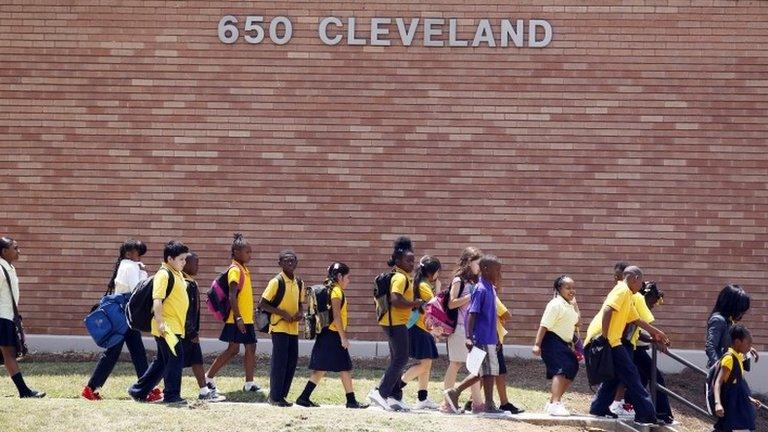 Students at Emma Hutchinson School in Atlanta leave after the day's classes 13 July 2011