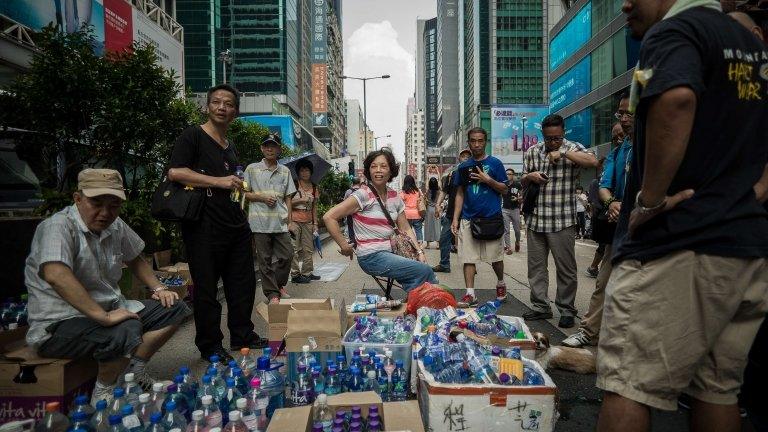 Supporters of pro-democracy demonstrators provide free drinking water in the Mongkok district of Hong Kong on 30 September 2014