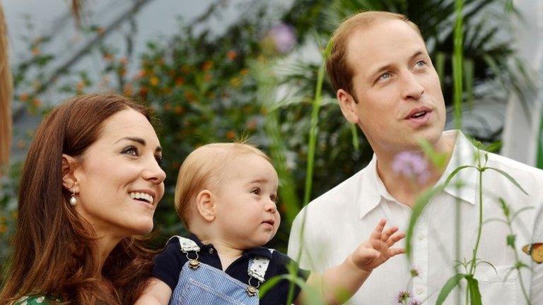 The Duke and Duchess of Cambridge in a posed photograph with Prince George