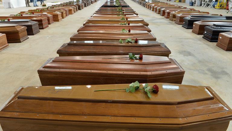 Coffins of shipwreck victims at Lampedusa airport, 5 October 2013