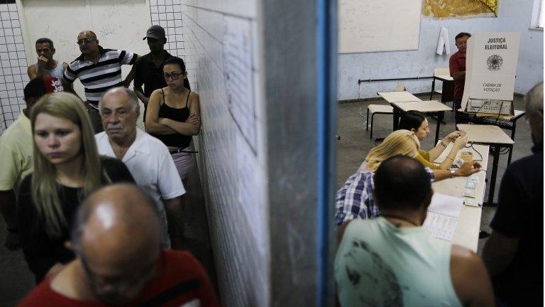 general elections inside a school in the Nova Holanda slum located in the Complexo da Mare in Rio de Janeiro, Brazil, Sunday, Oct. 5, 2014