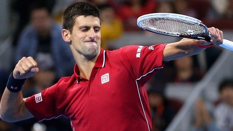 Novak Djokovic celebrates his fifth China Open triumph