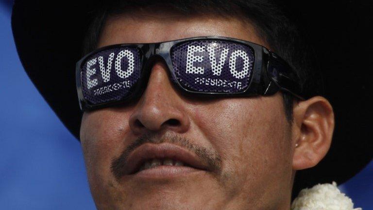 A supporter of President Evo Morales attends the closing campaign rally in El Alto, Bolivia on 8 October, 2014