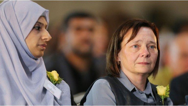 Alan Henning's widow (r) at memorial service