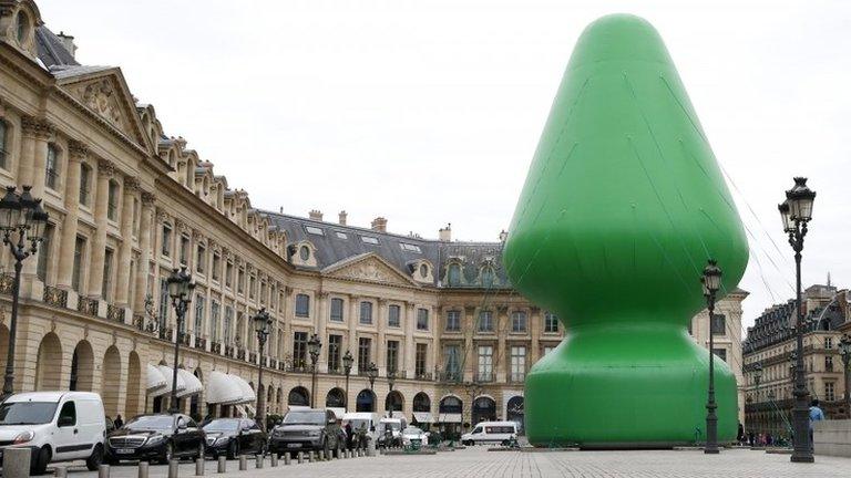 The sculpture entitled Tree by US artist Paul McCarthy on display at the Place Vendome in Paris, France, 16 October