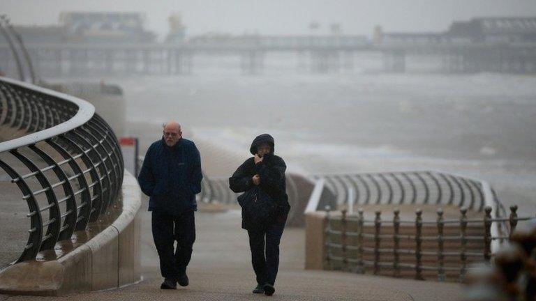 Visitors brave high winds and rain on Blackpool promenade