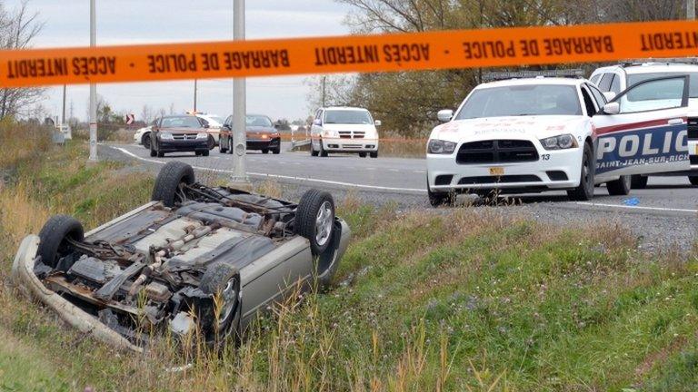 A car is overturned in the ditch in St-Jean-sur-Richelieu, Quebec, on 20 October 2014