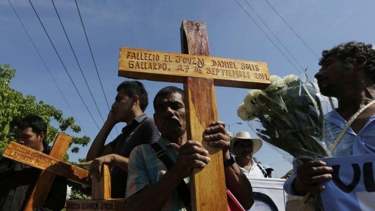 Relatives of missing students of the Ayotzinapa Teacher Training College, Raul Isidro Burgos, participate in a march on 27 October 2014