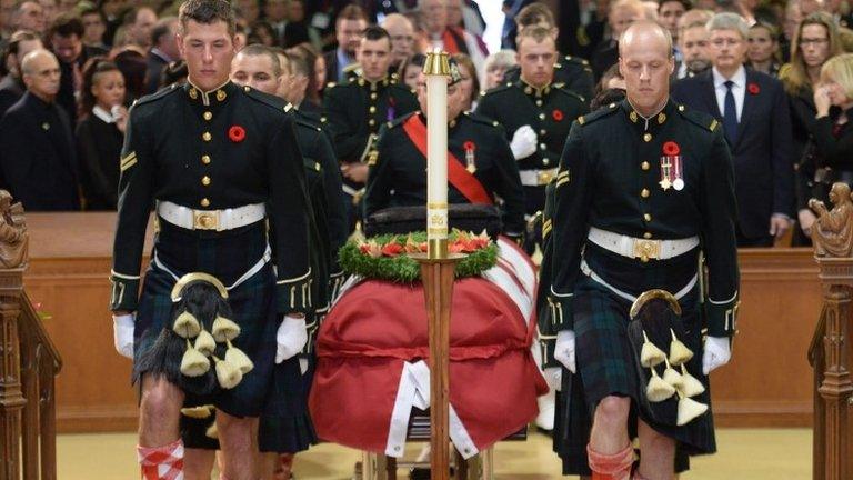 The casket of Cpl Nathan Cirillo is carried by pallbearers at his regimental funeral service in Hamilton, Ontario 28 October 2014