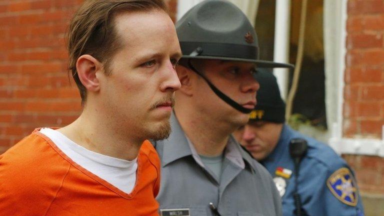 Eric Frein is escorted by police out the Pike County Courthouse after his arraignment in Milford, Pennsylvania 31 October 2014