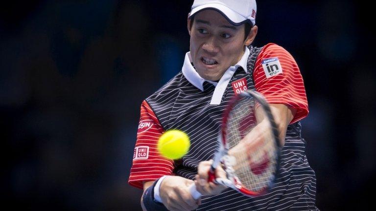 Kei Nishikori hits a two handed backhand