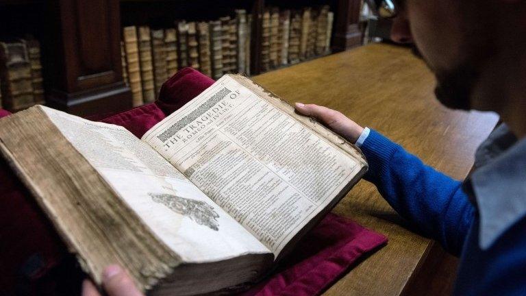 Remy Cordonnier holds the Shakespeare Folio