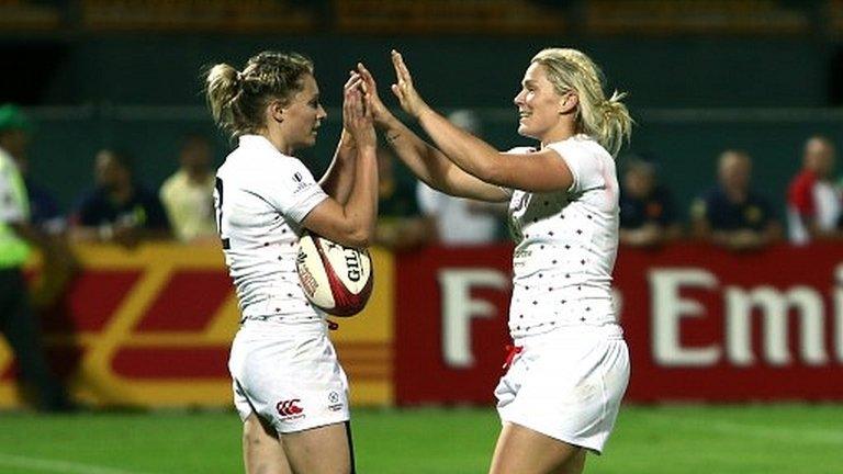 Natasha Hunt of England is congratulated after scoring the winning try against Fiji