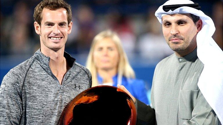 Andy Murray receives the trophy