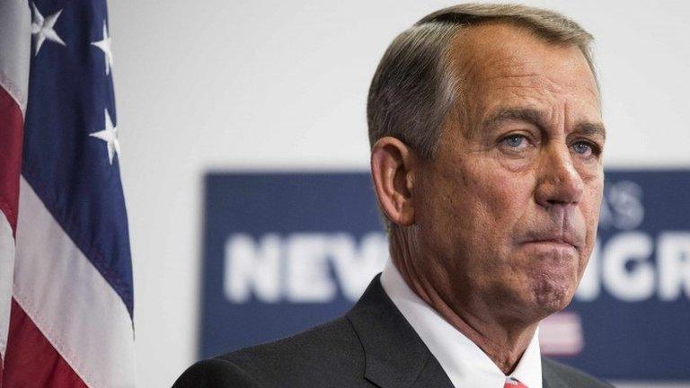 Speaker of the House John Boehner listens as his fellow Republicans speak to the media after a conference meeting with House Republicans on Capitol Hill in Washington 21 January 2015