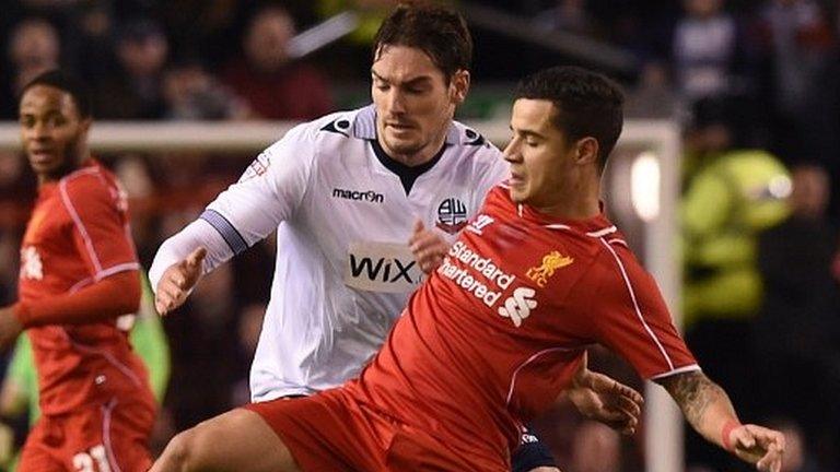 Bolton's Dorian Dervite (left) and Liverpool's Philippe Coutinho