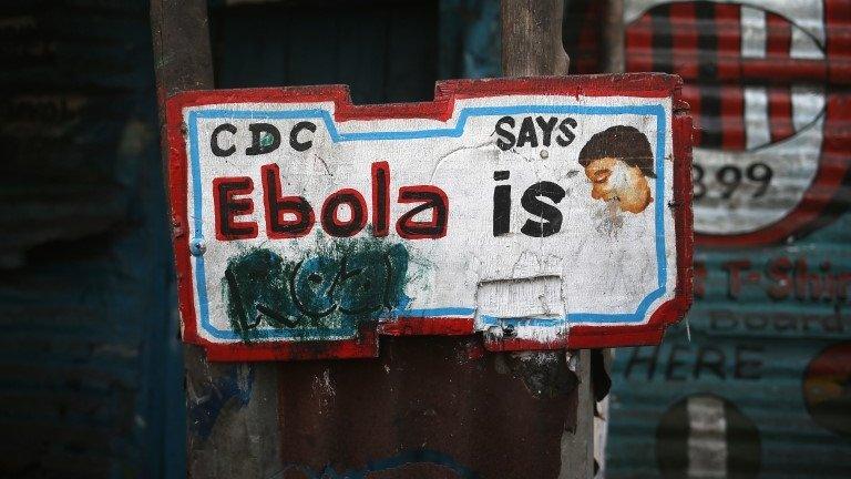 Am Ebola sign hangs in the West Point township on 1 February 2015 in Monrovia, Liberia