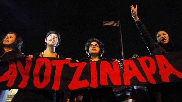 Women hold a banner reading Ayotzinapa in Ciudad Juarez on 26 January, 2015.