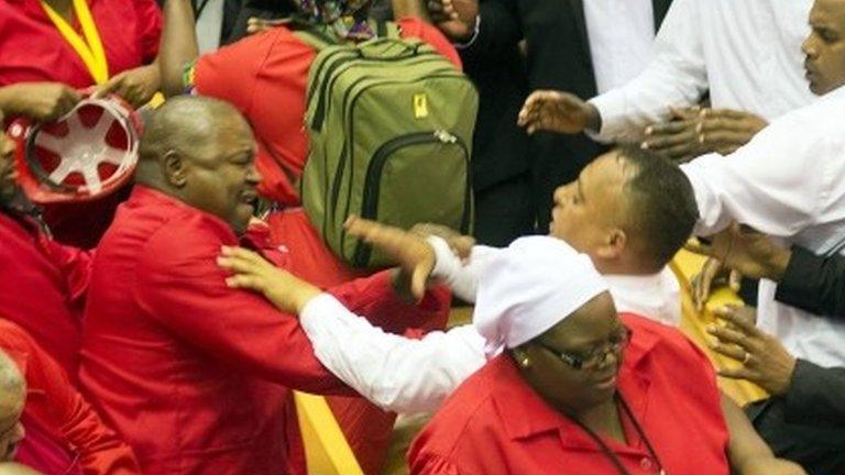 MPs and security officers scuffle in parliament